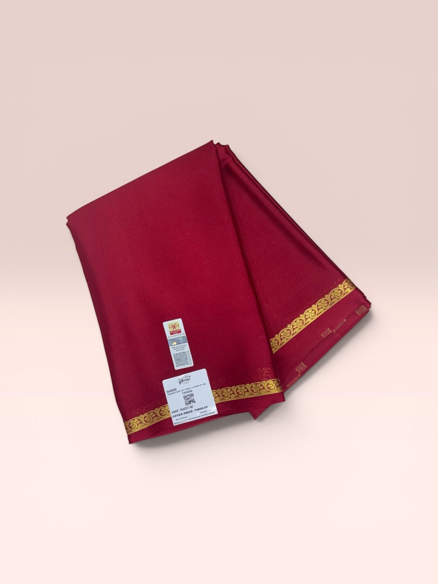 SRI NANDINI SILKS red crepe silk saree with gold border and traditional self pattern. Approx 6m length.