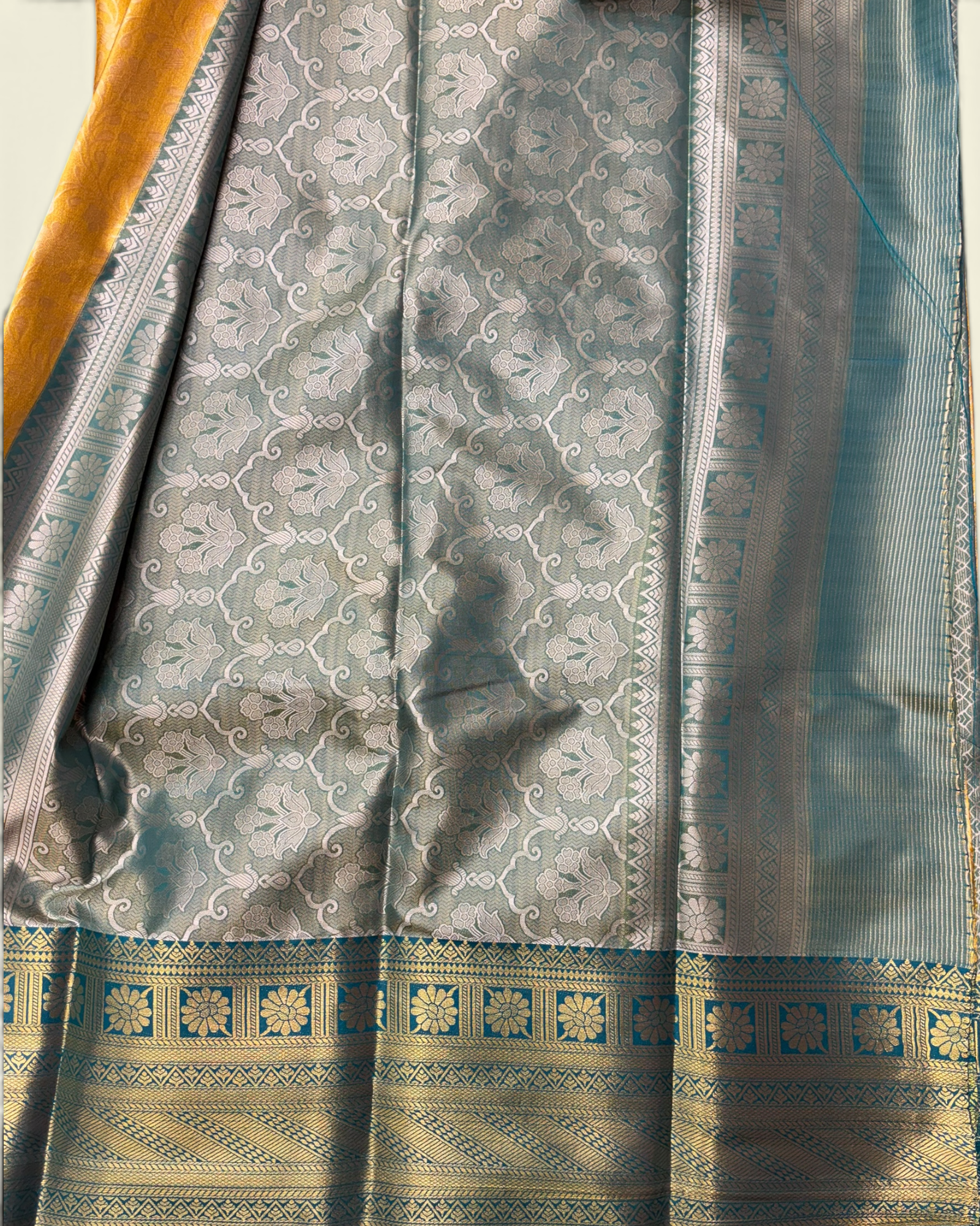 Trending Golden Soft Tissue with Contrast Teal Green Border Saree (NHM7045_1)