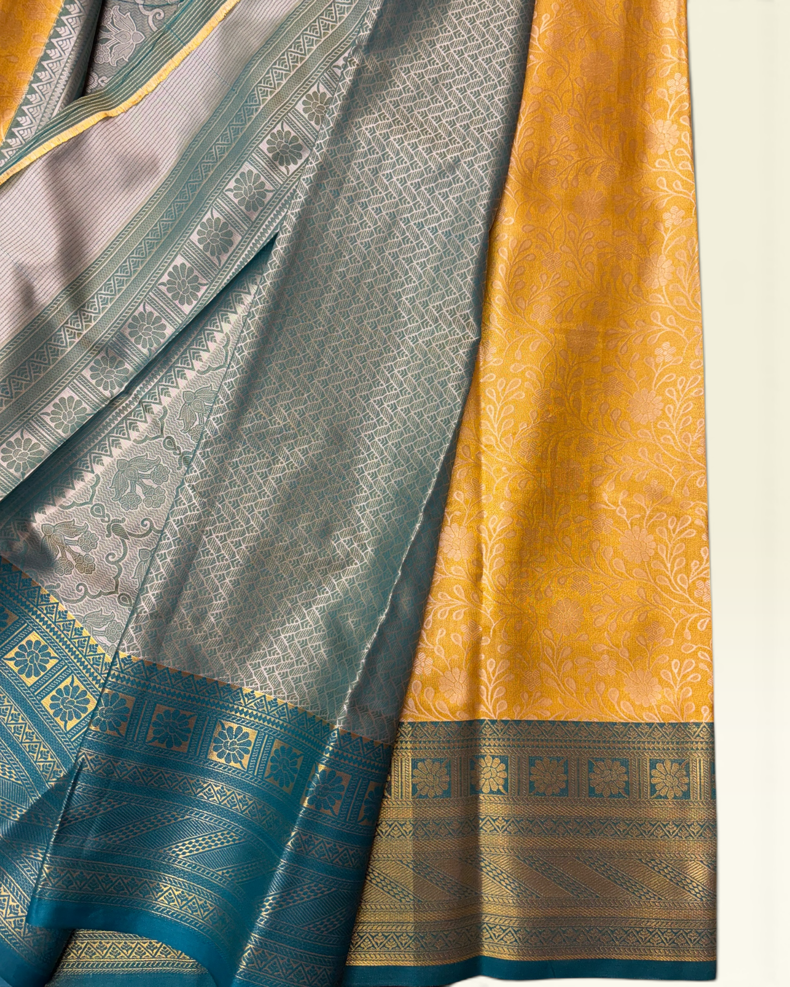 Trending Golden Soft Tissue with Contrast Teal Green Border Saree (NHM7045_1)