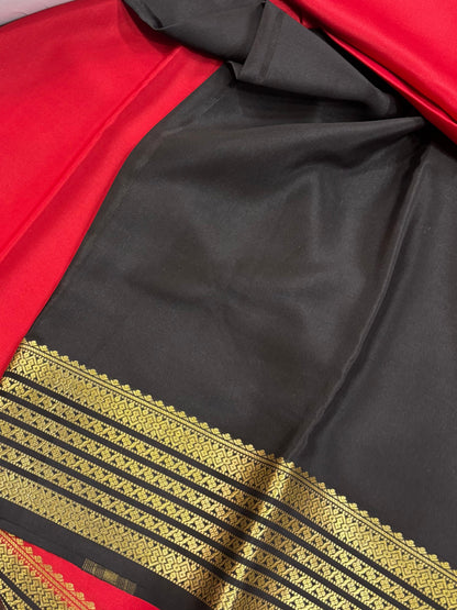 SRI NANDINI SILKSH Trending red and black pure silk saree with gold border detail. Traditional self pattern.